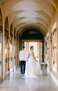 Bride and groom walking in the Hallway of Del Mar Villa in Dundee Oregon