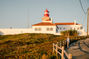 Light house and buildings fences with shrub located in Roca Boca in Portugal about 30 minutes from Sintra. 