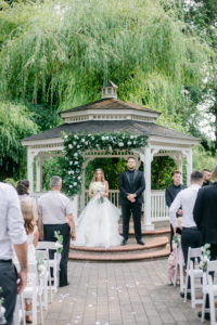 Bride and groom at the gazebo alter at the Abernathy Center in Oregon City, Oregon